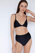 Model wearing Ladoga Sustainable Bikini Bottom in Black by Ozero Swimwear, close-up on details, designed in Kuala Lumpur, Malaysia.