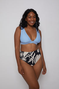 Ozero Swimwear sustainable bikini top in sky blue on a dark-skin model, front, Kuala Lumpur, Malaysia