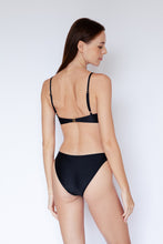 Model wearing Malawi Bikini Top in Black by Ozero Swimwear, back view, designed in Malaysia.