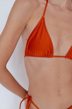 Close-up on details of Sinclair Bikini Top in Shimmer Burnt Orange by Ozero Swimwear, front view, designed in Malaysia.