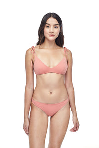 Ozero Swimwear Como minimal Bikini Set in Dusty Coral, on a model, front view, sustainable fabrics, made in Bali.