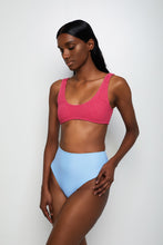 Ozero Swimwear sustainable bikini bottom in sky blue on a dark-skin model, front, Kuala Lumpur, Malaysia